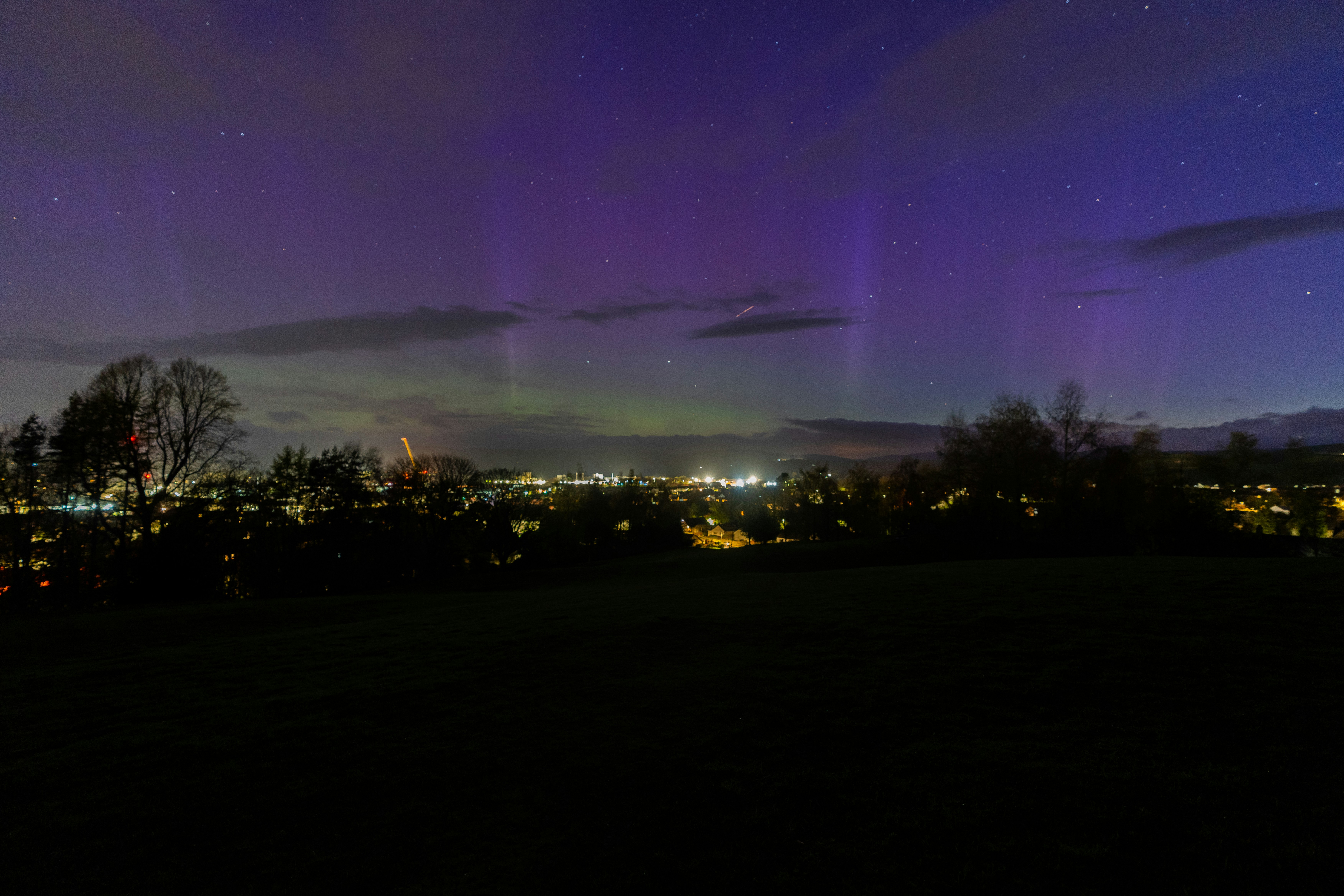 A view of a city at night from a hill photo – Free Aurora Image on Unsplash