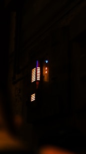 Close-up of a digital control panel with glowing blue and orange indicators.