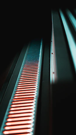 A sleek LED bar glowing softly under ambient lighting at a chic private event.