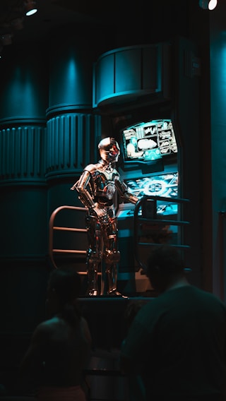 a man standing in front of a tv in a dark room