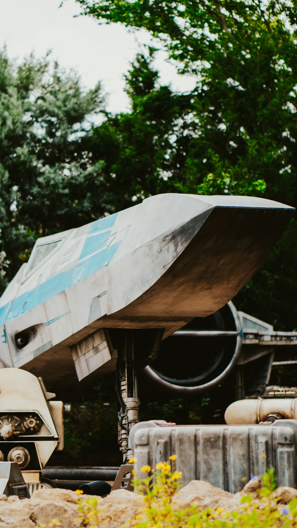 a boat sitting on top of a cement structure