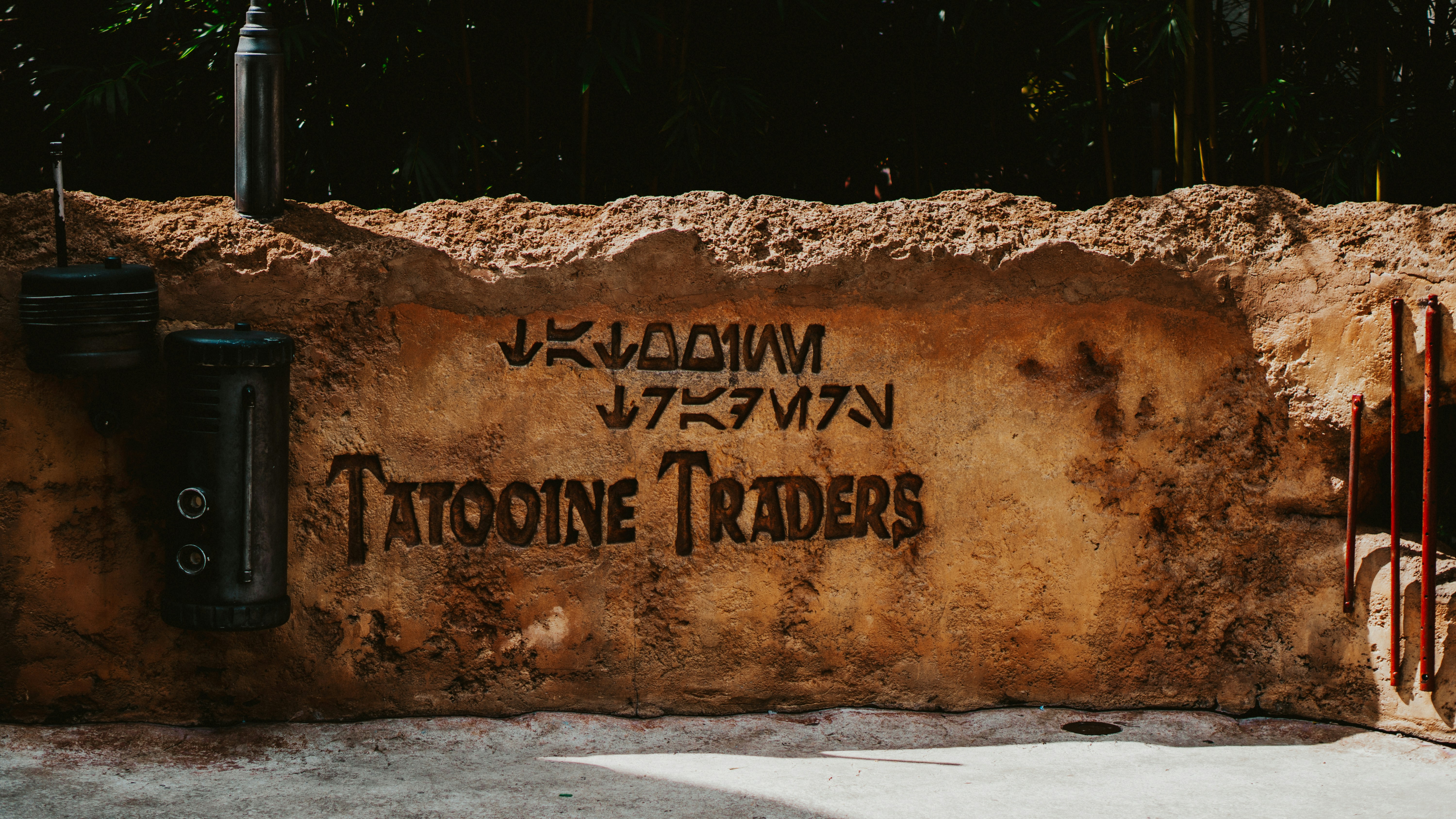 a stone wall that has writing on it