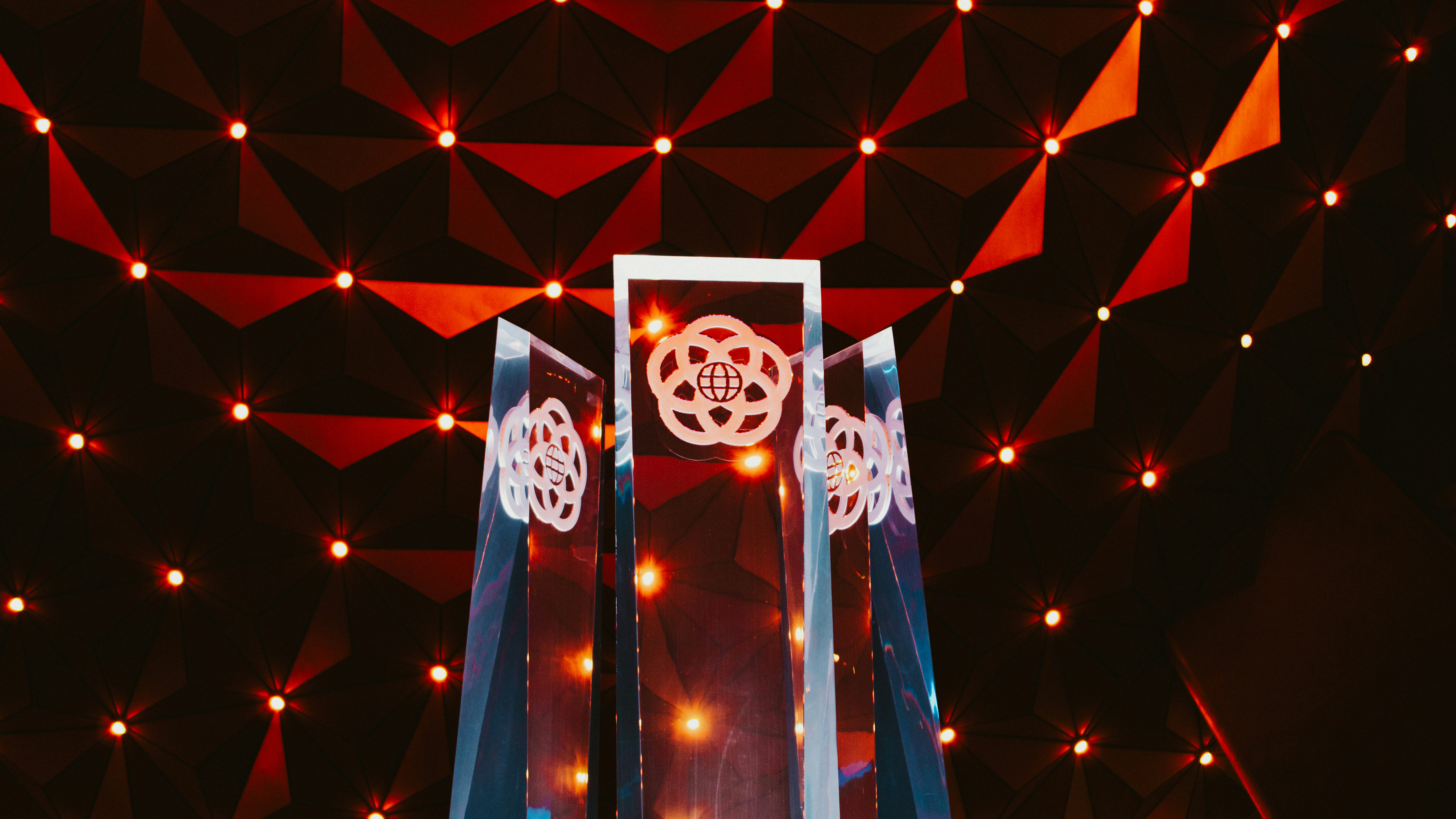 A lighted display with a red and black background