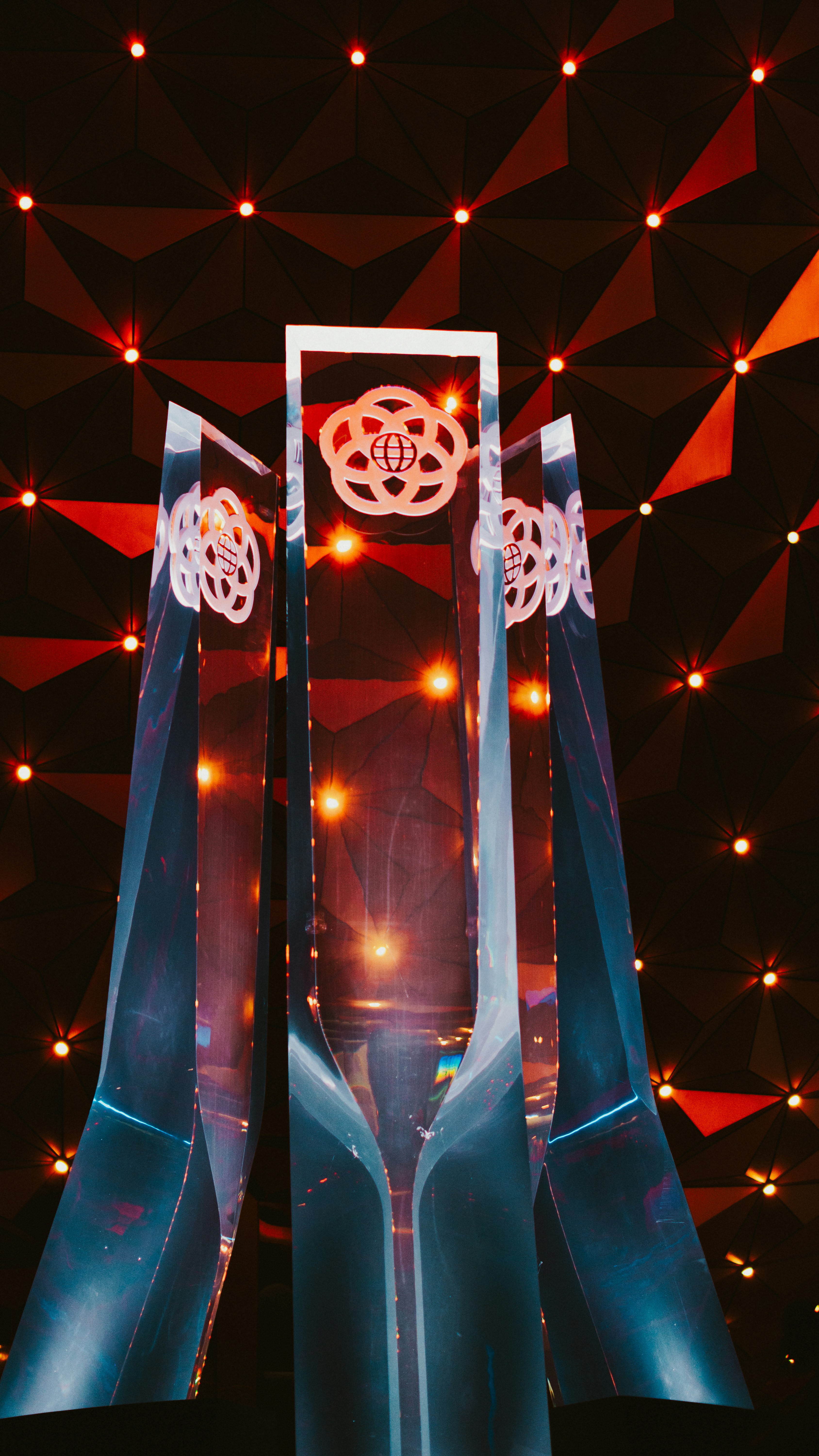 a giant mirror with lights in the background