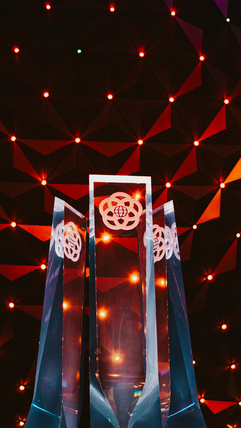 Award ceremony stage with spotlight and trophy presentation moment