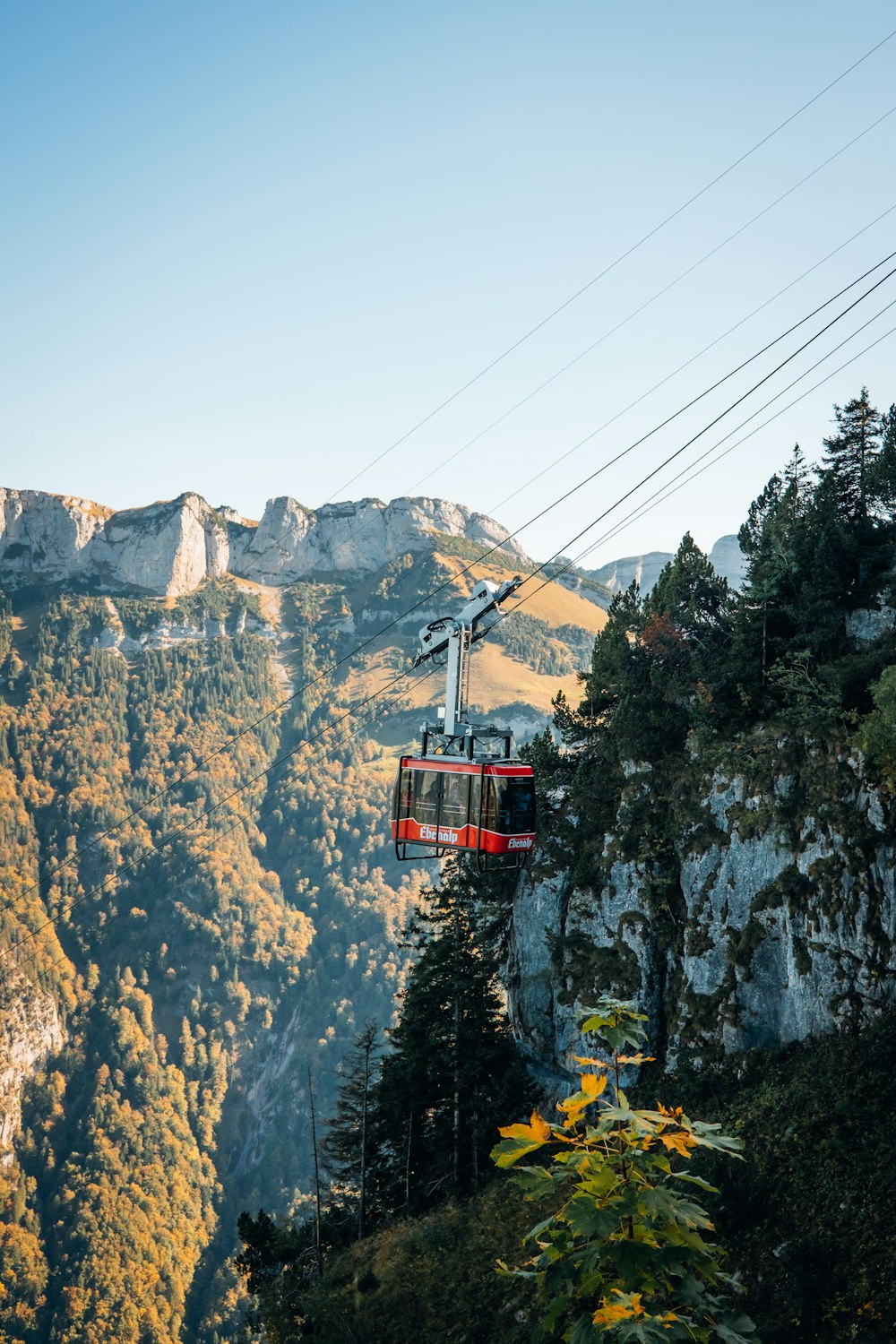 a cable car going up a mountain side