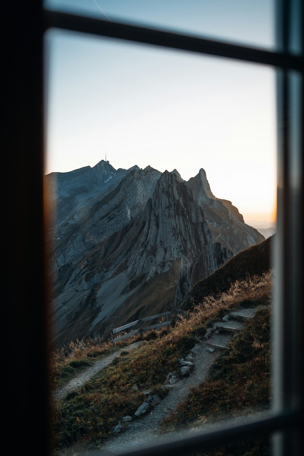 a view of a mountain from a window