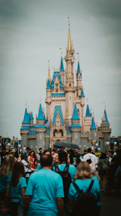 a group of people standing in front of a castle