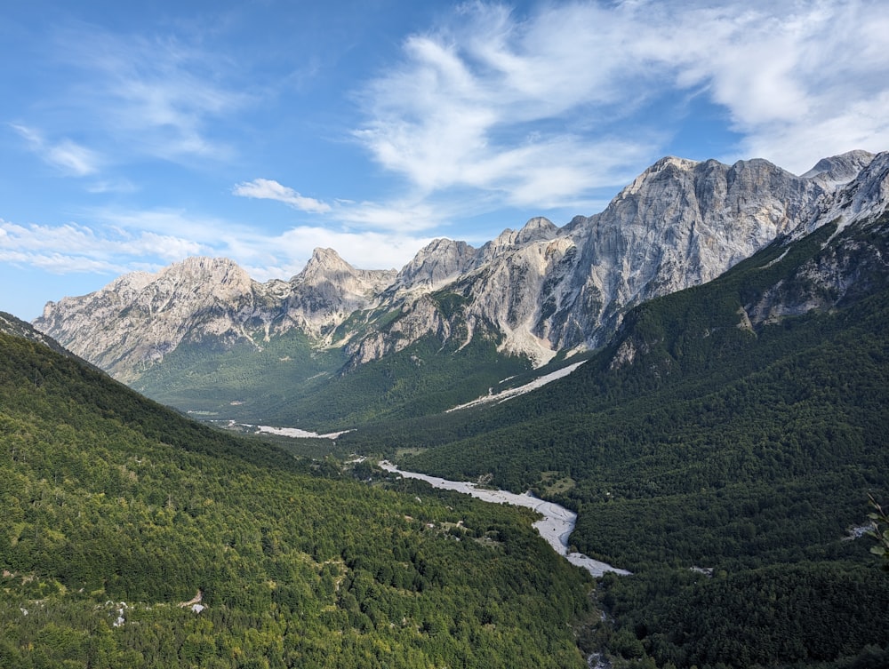 a view of a valley with a river running through it