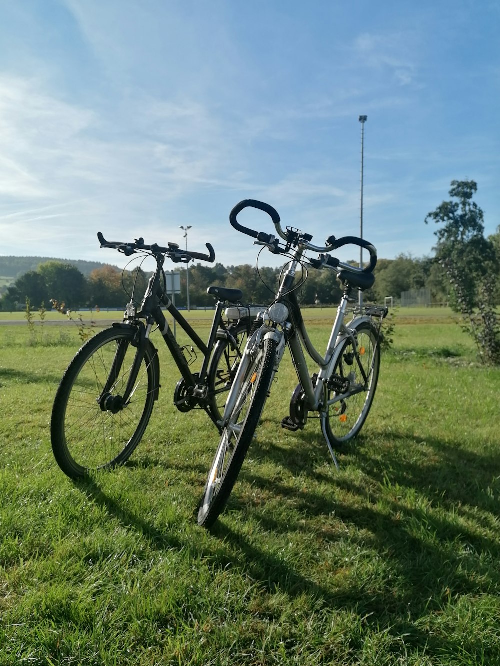 a couple of bikes that are sitting in the grass