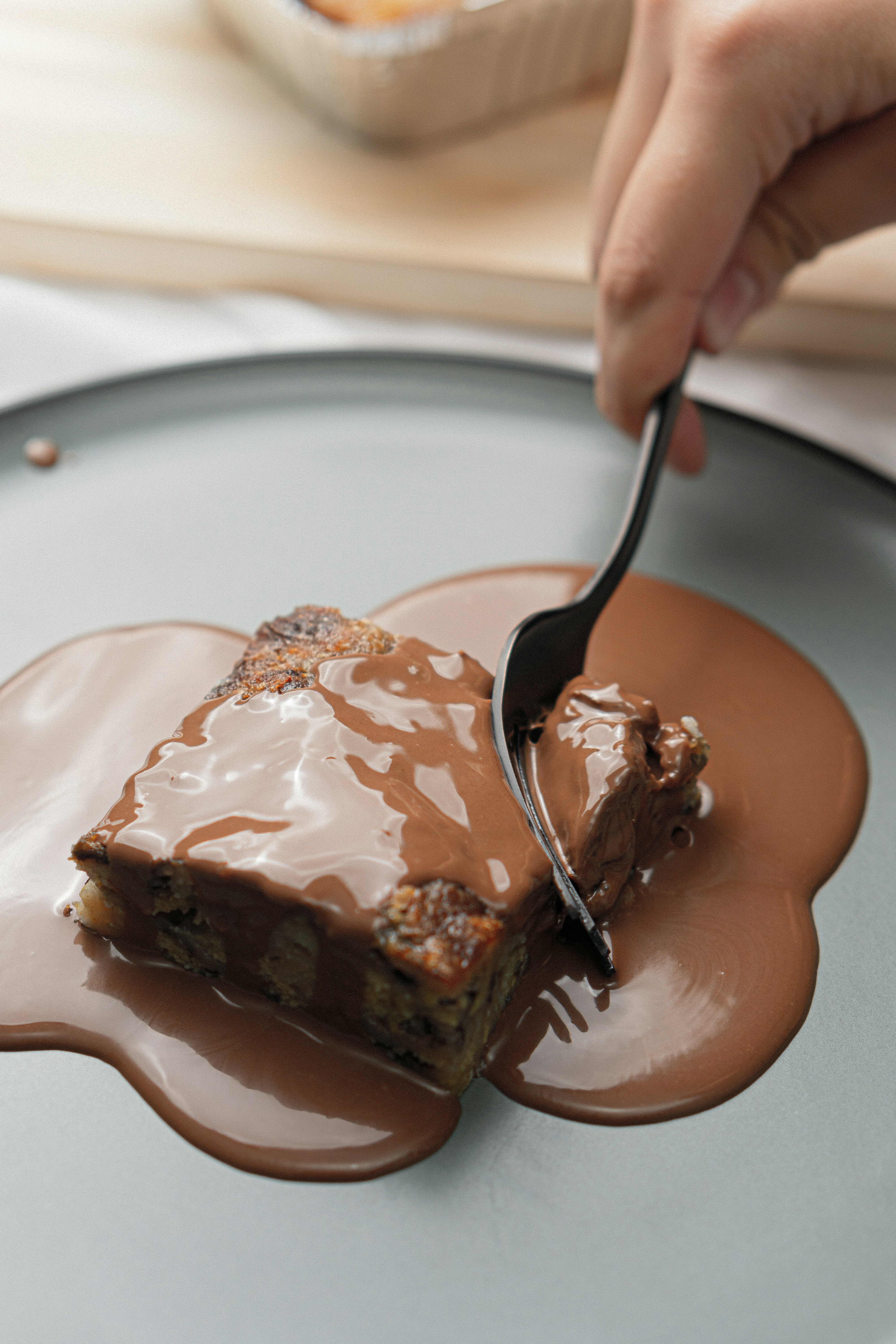 a person eating a piece of cake with a fork