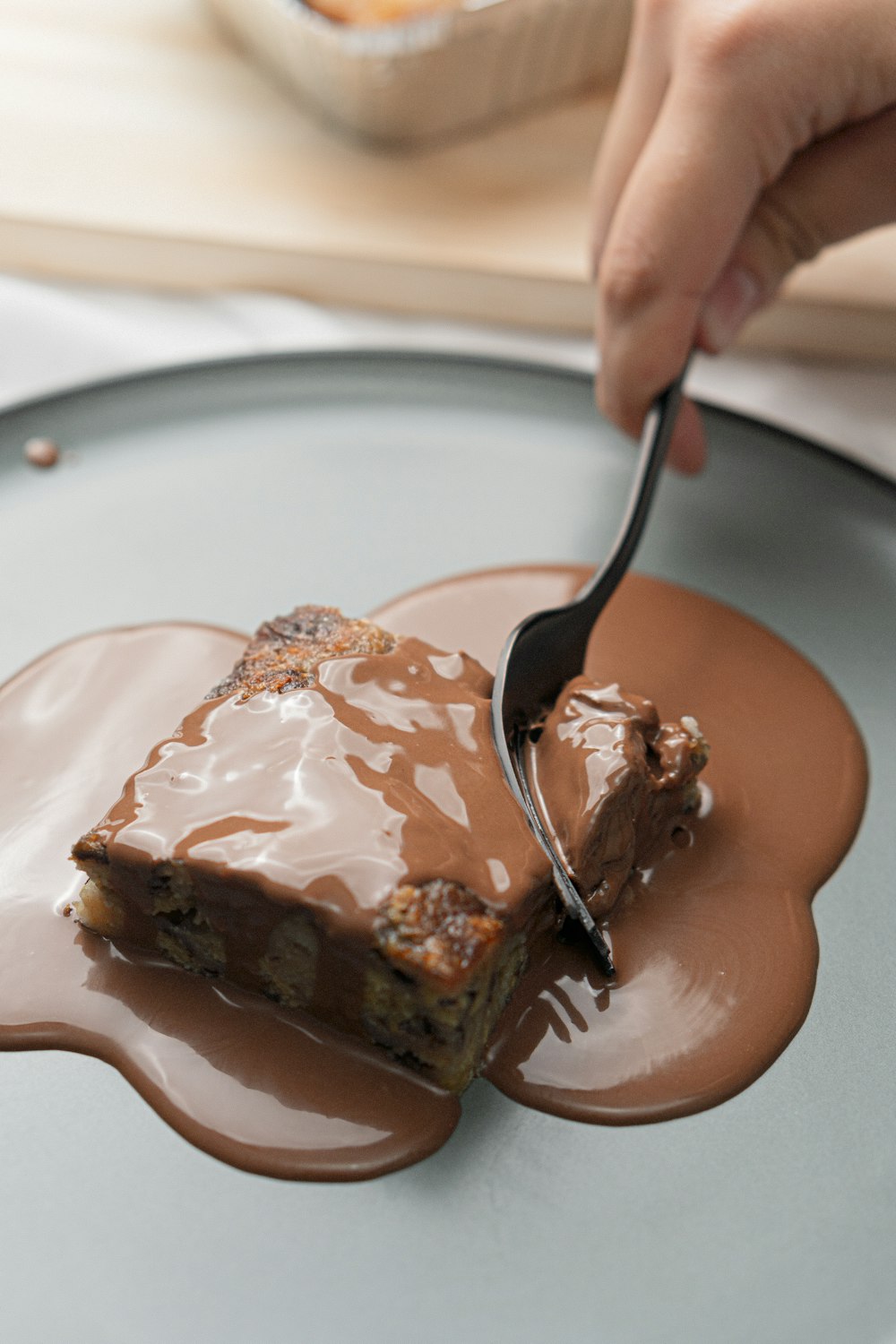 a person eating a piece of cake with a fork