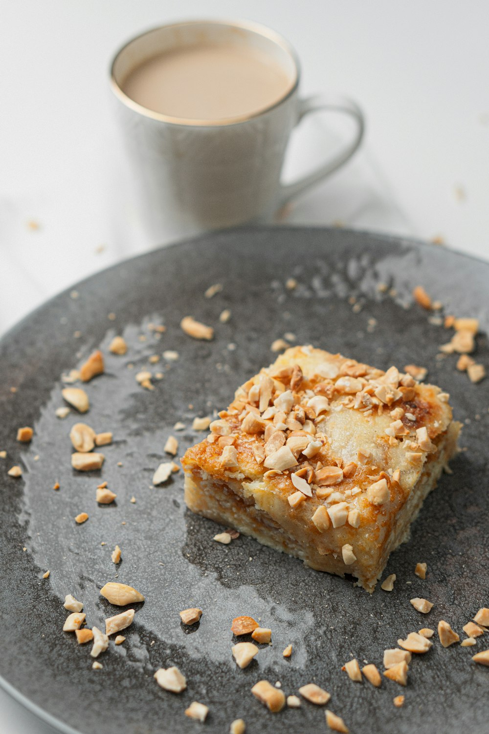 a plate with a piece of cake and a cup of coffee