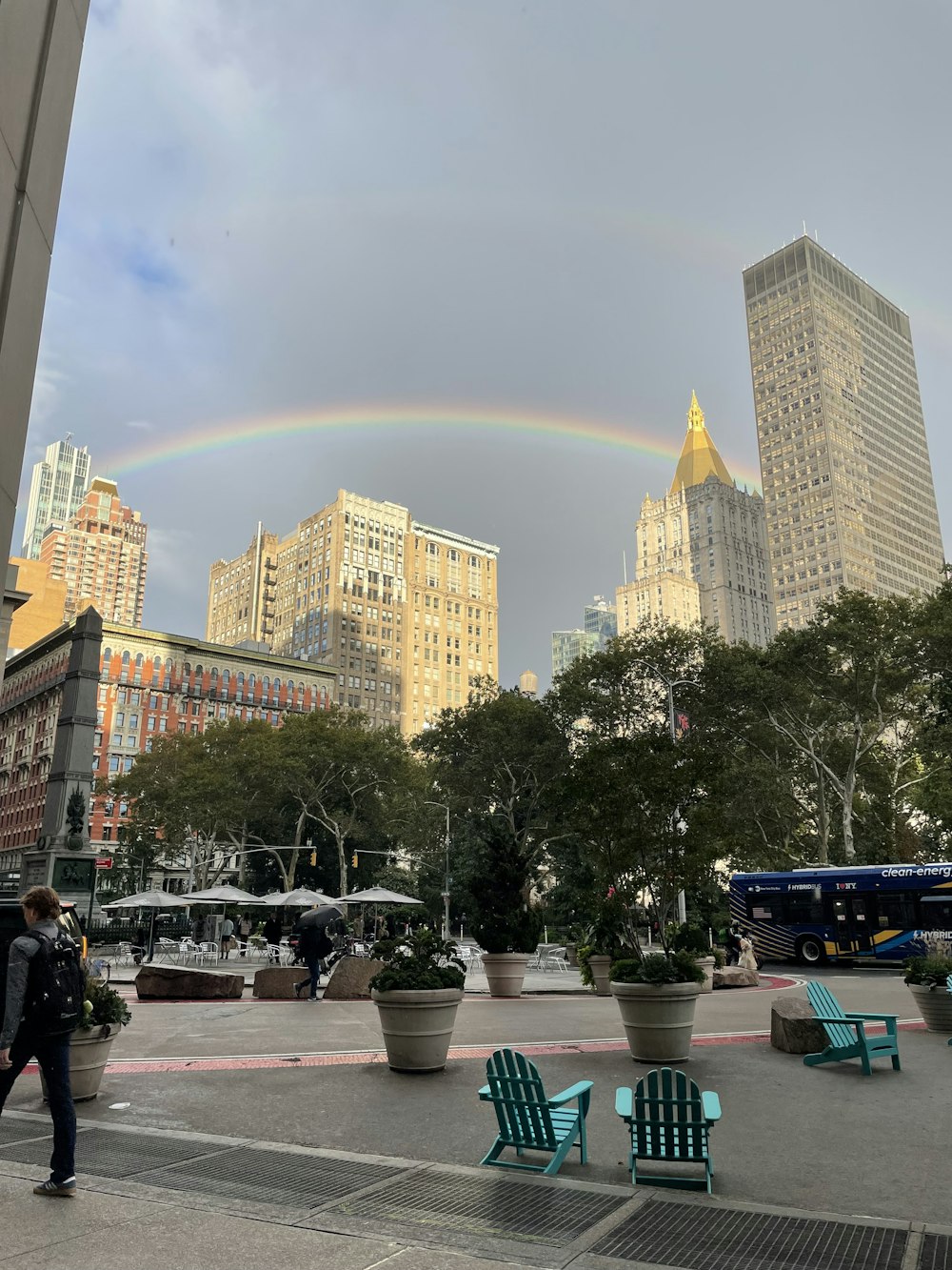 a rainbow in the sky over a city