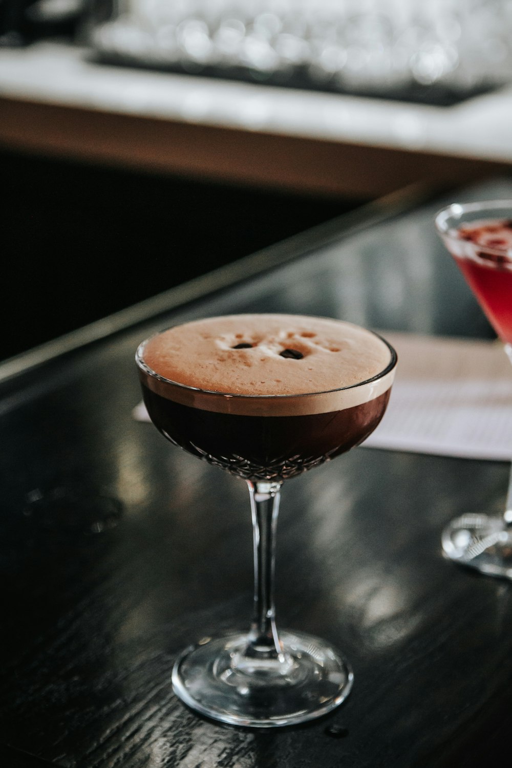 a close up of two drinks on a table