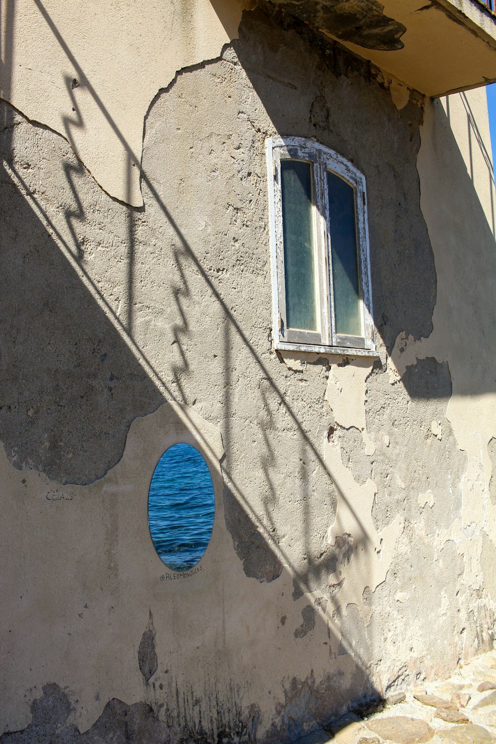 a building with a blue circle on the side of it