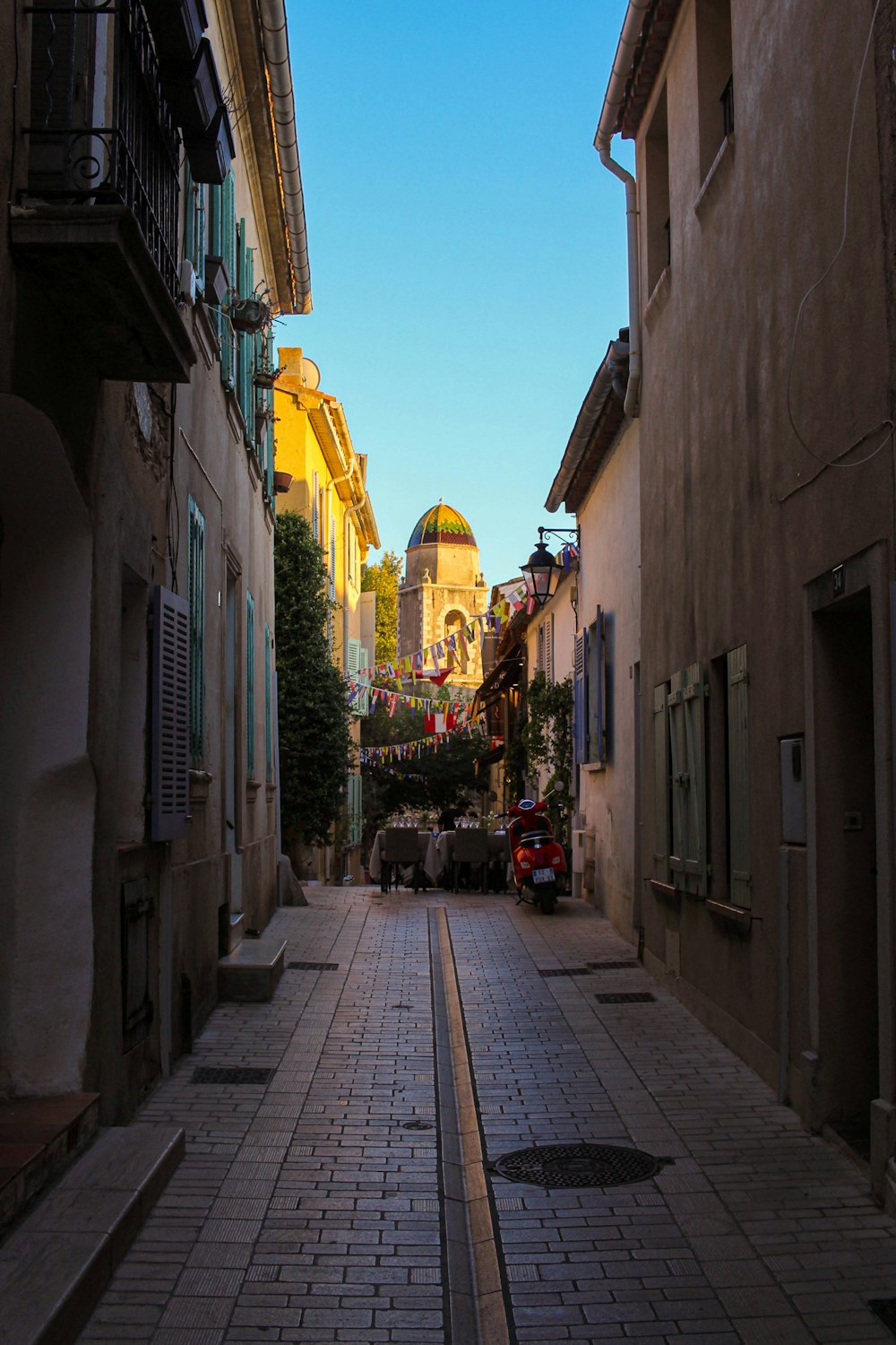 a narrow street with buildings on both sides