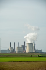 a factory with smoke coming out of it's stacks