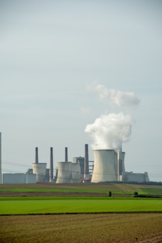 a factory with smoke coming out of it's stacks