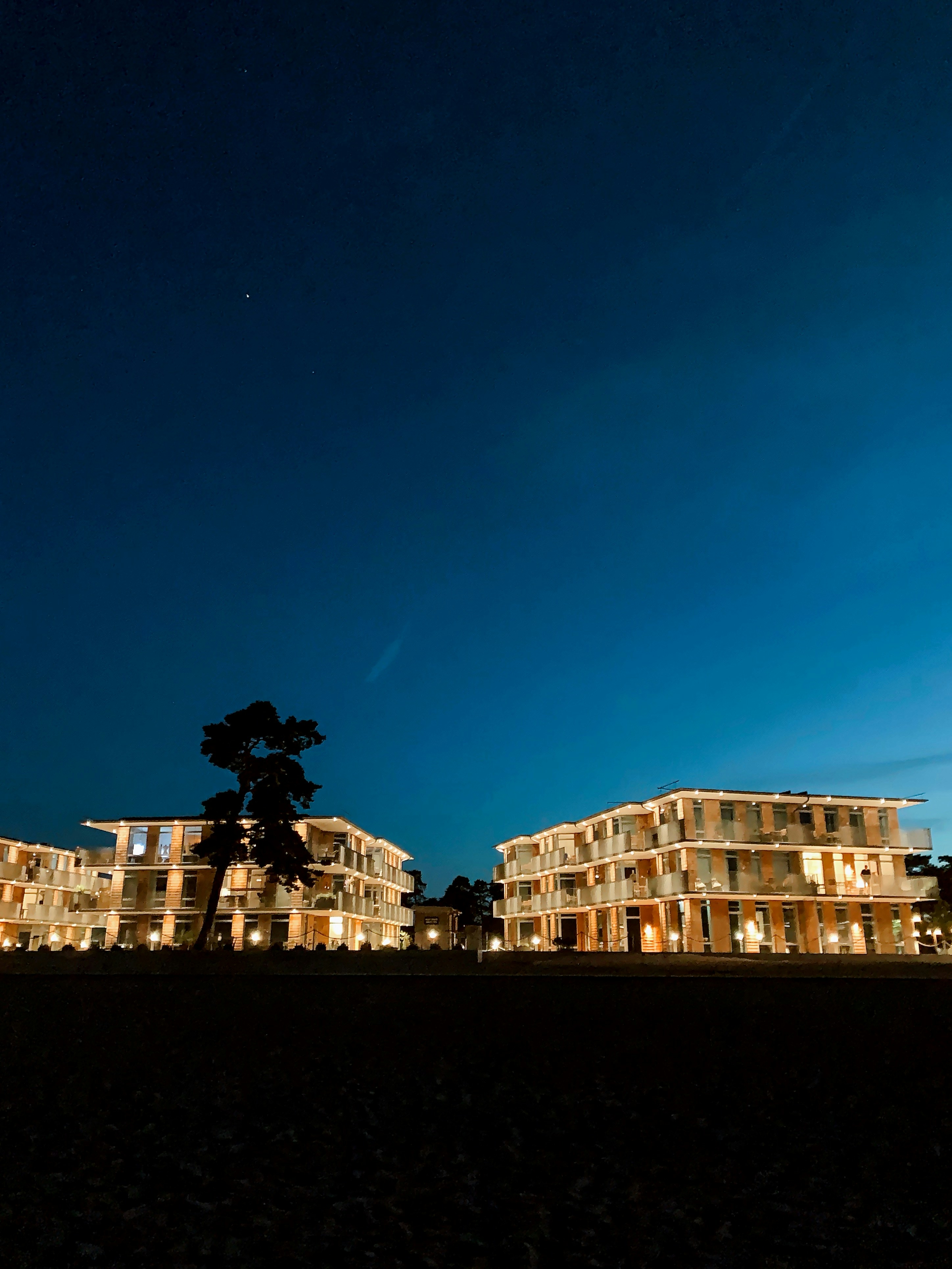 a couple of buildings that are lit up at night