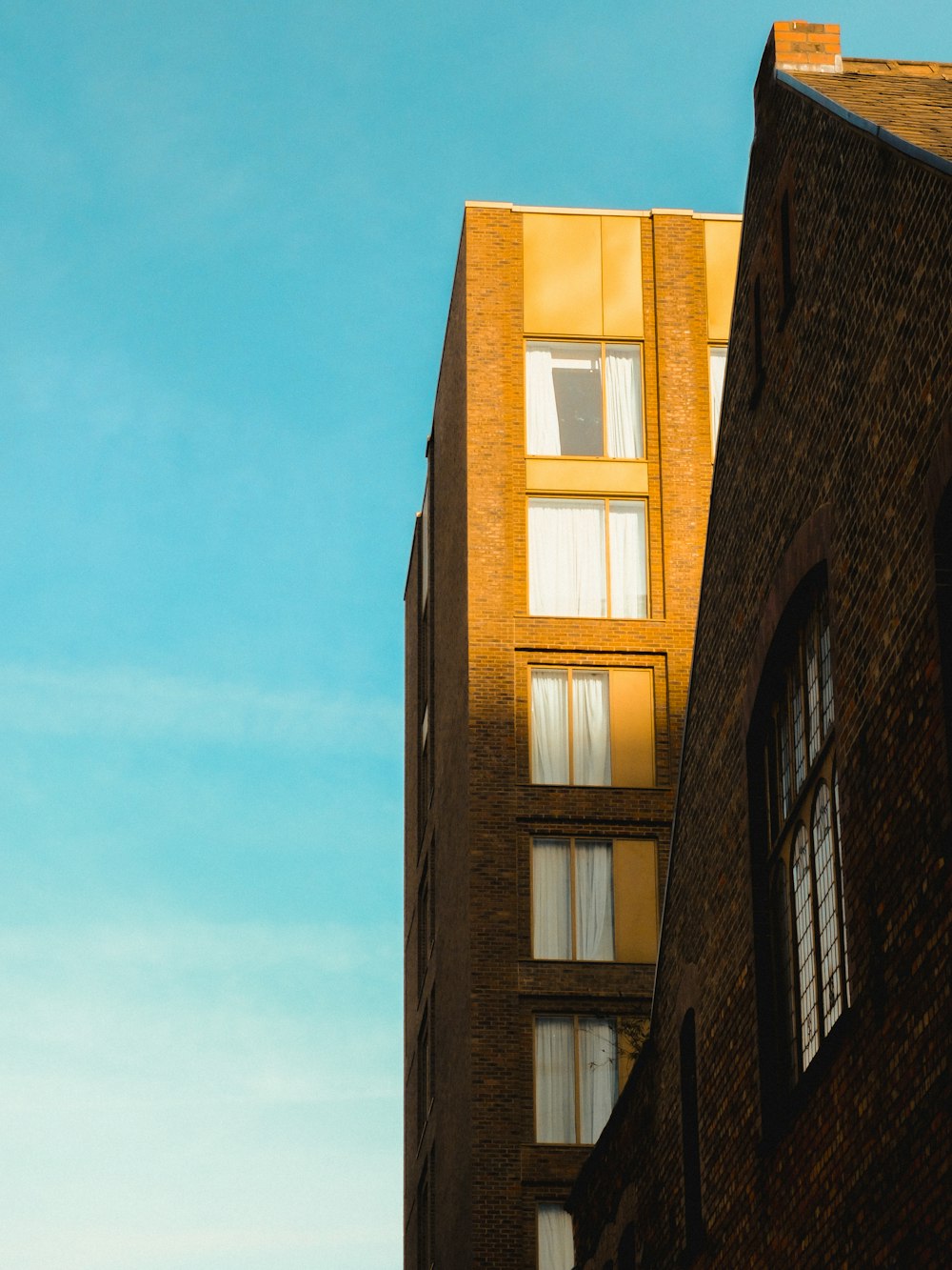 a tall brick building with lots of windows