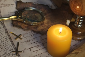 A researcher examining old family documents with a magnifying glass.