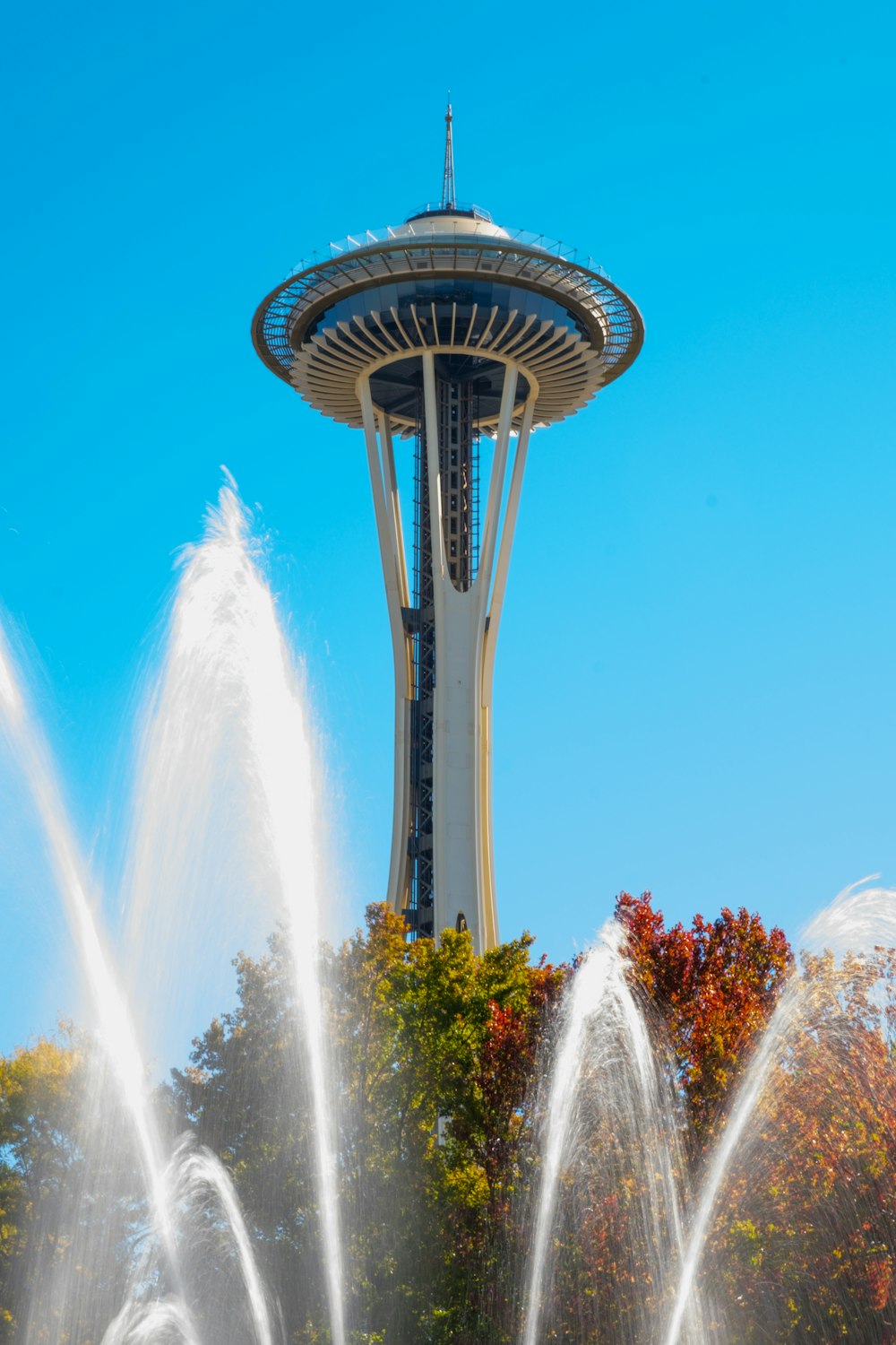 a large water fountain in front of a tall building