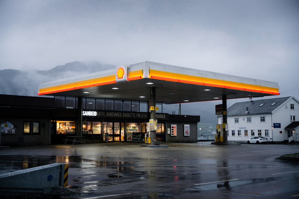 a gas station on a rainy day with a cloudy sky