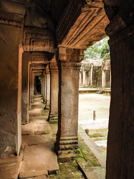 a row of stone pillars in a building