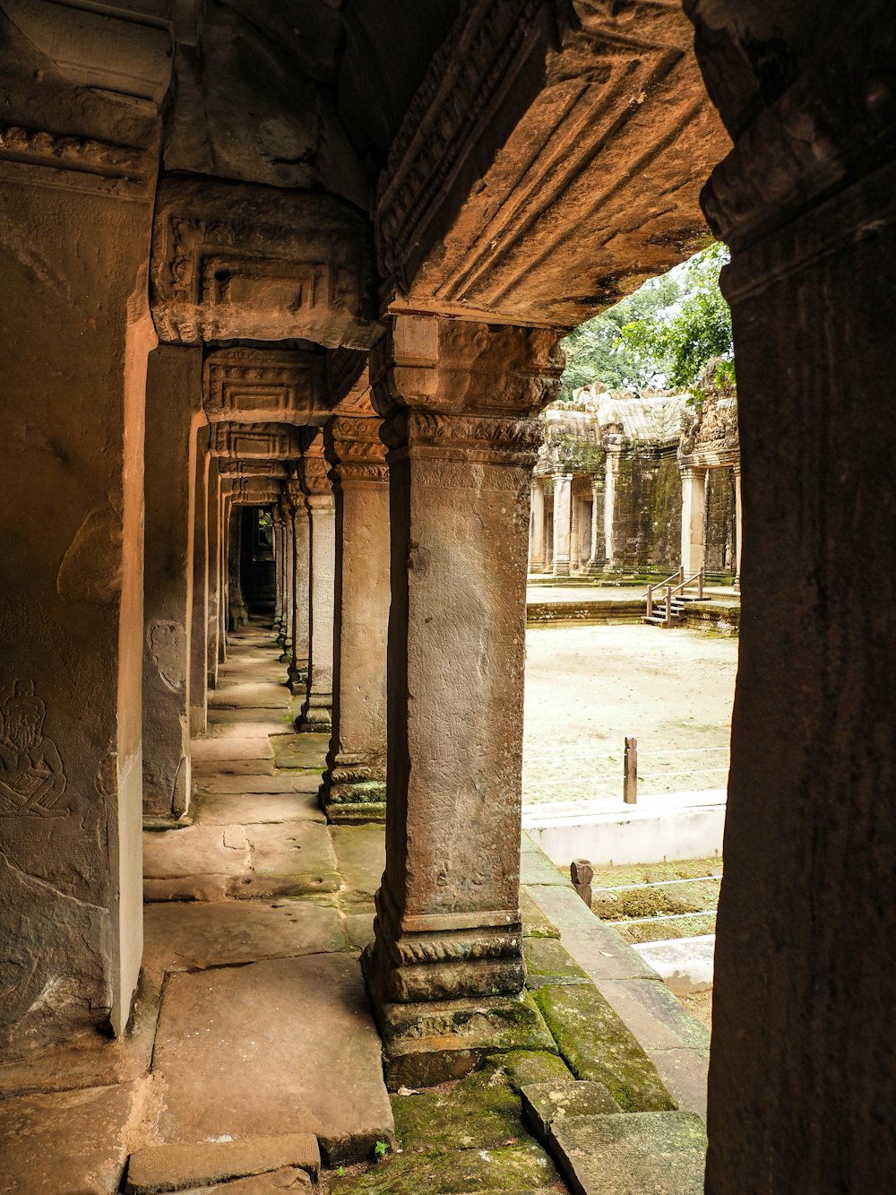 a row of stone pillars in a building