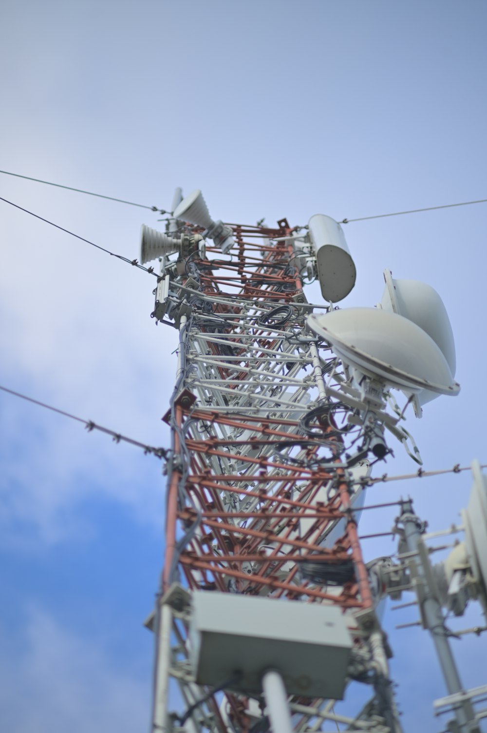 a tall tower with multiple antennas on top of it