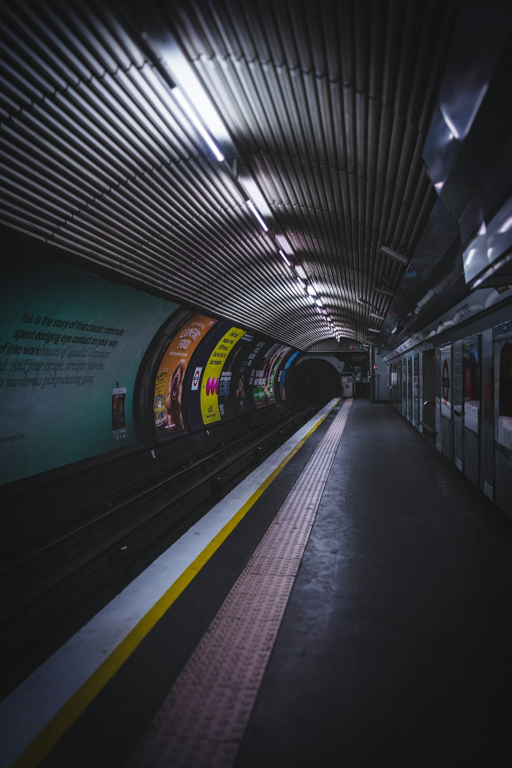 a subway train pulling into a train station