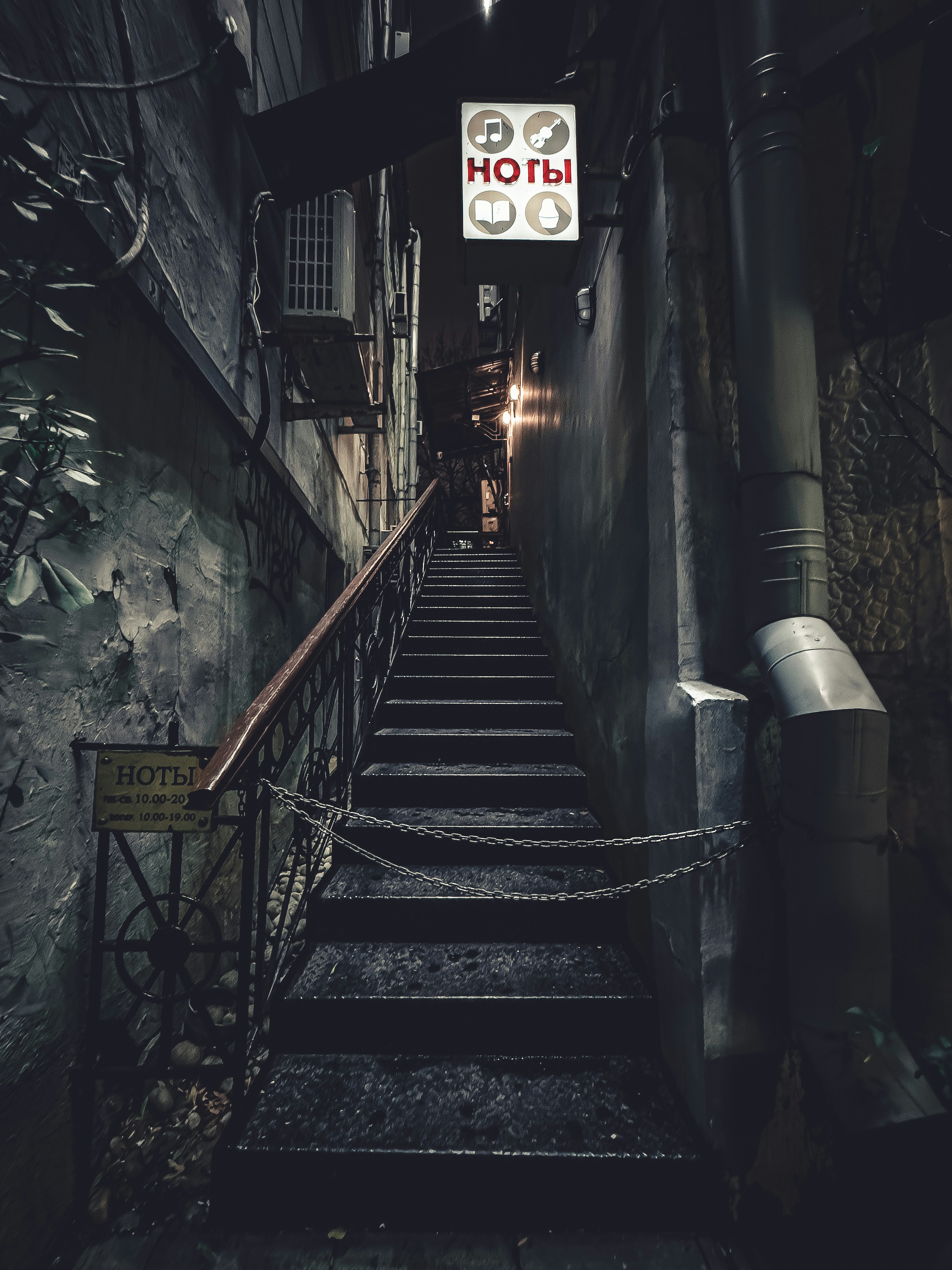 a set of stairs leading up to a hotel sign