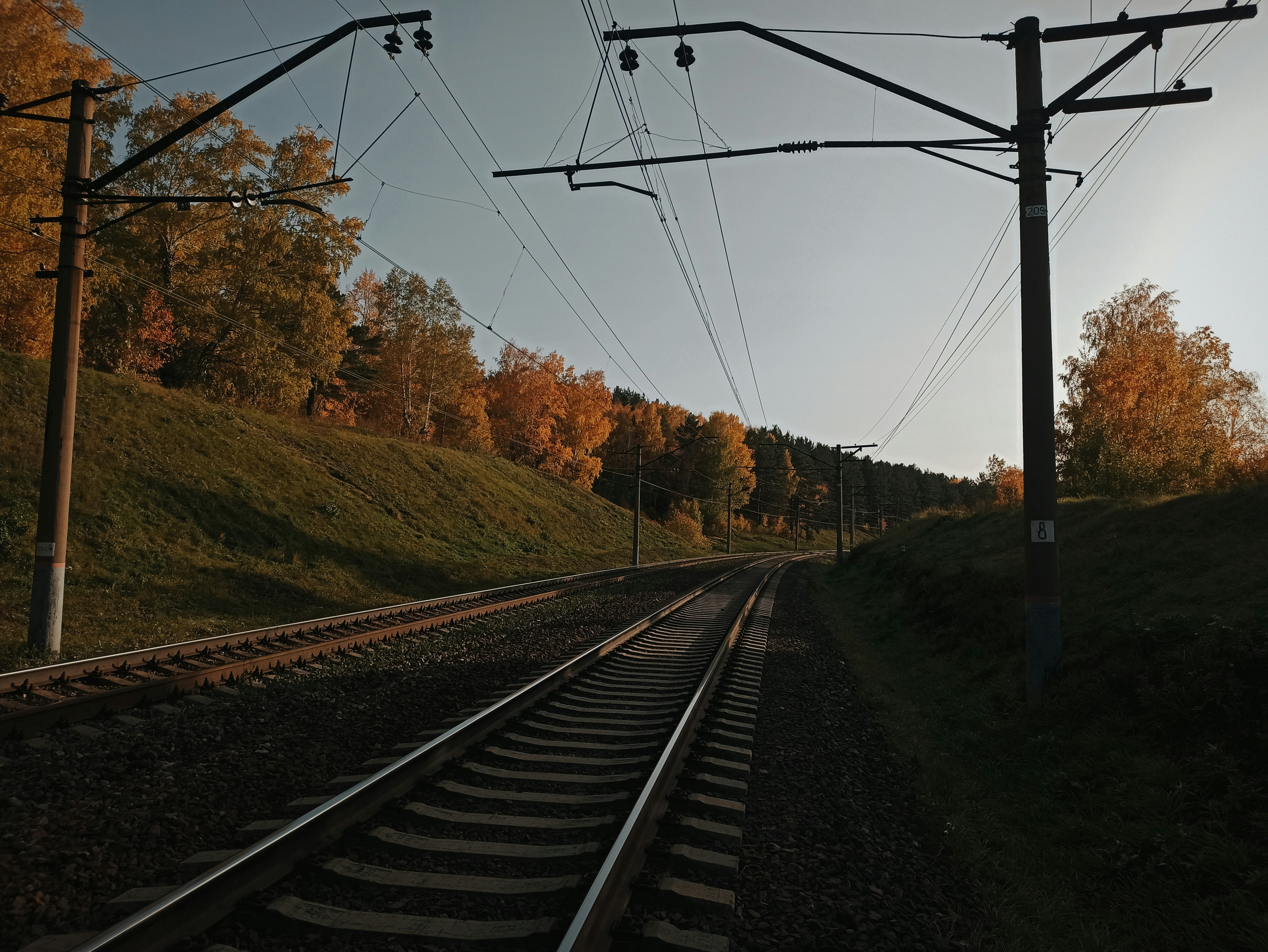 a train track running through a rural countryside