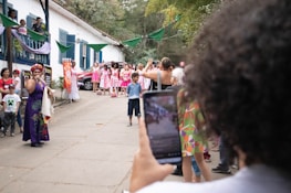 Warm shot of an Austin Legal Crew volunteer speaking to community members at a neighborhood event.