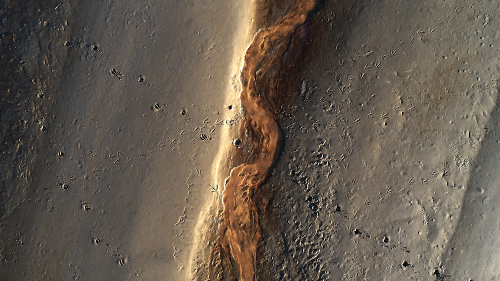 a stream of water running down the side of a mountain