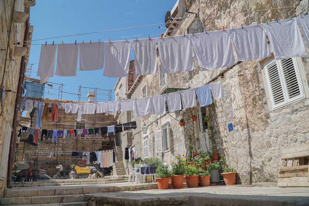 a bunch of clothes hanging on a clothes line