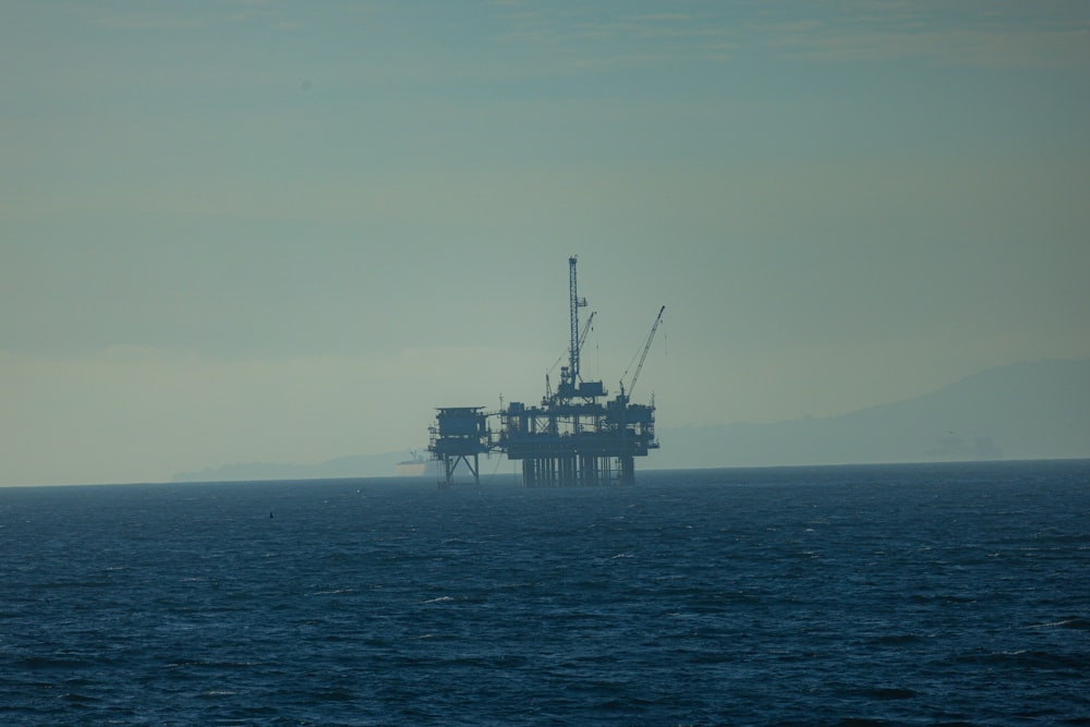 an oil rig in the middle of the ocean