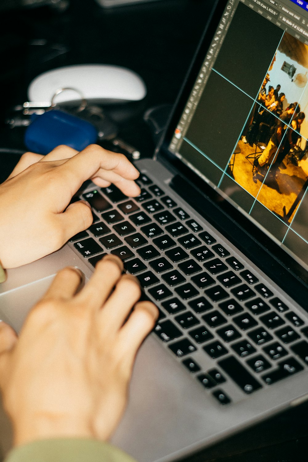 a person using a laptop computer on a desk