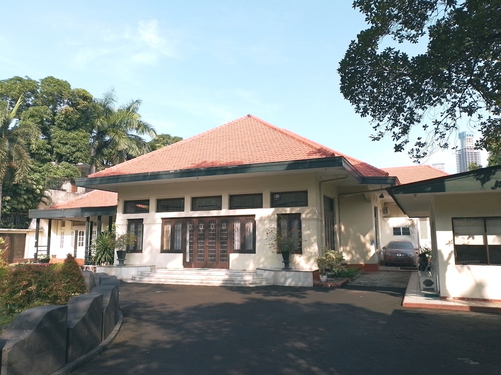 a large white house with a red roof