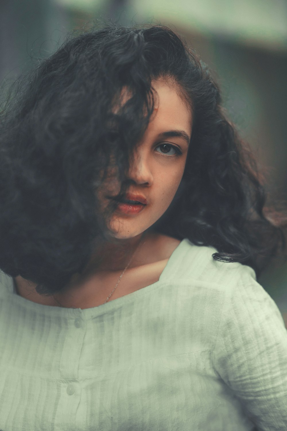 a close up of a person with long hair