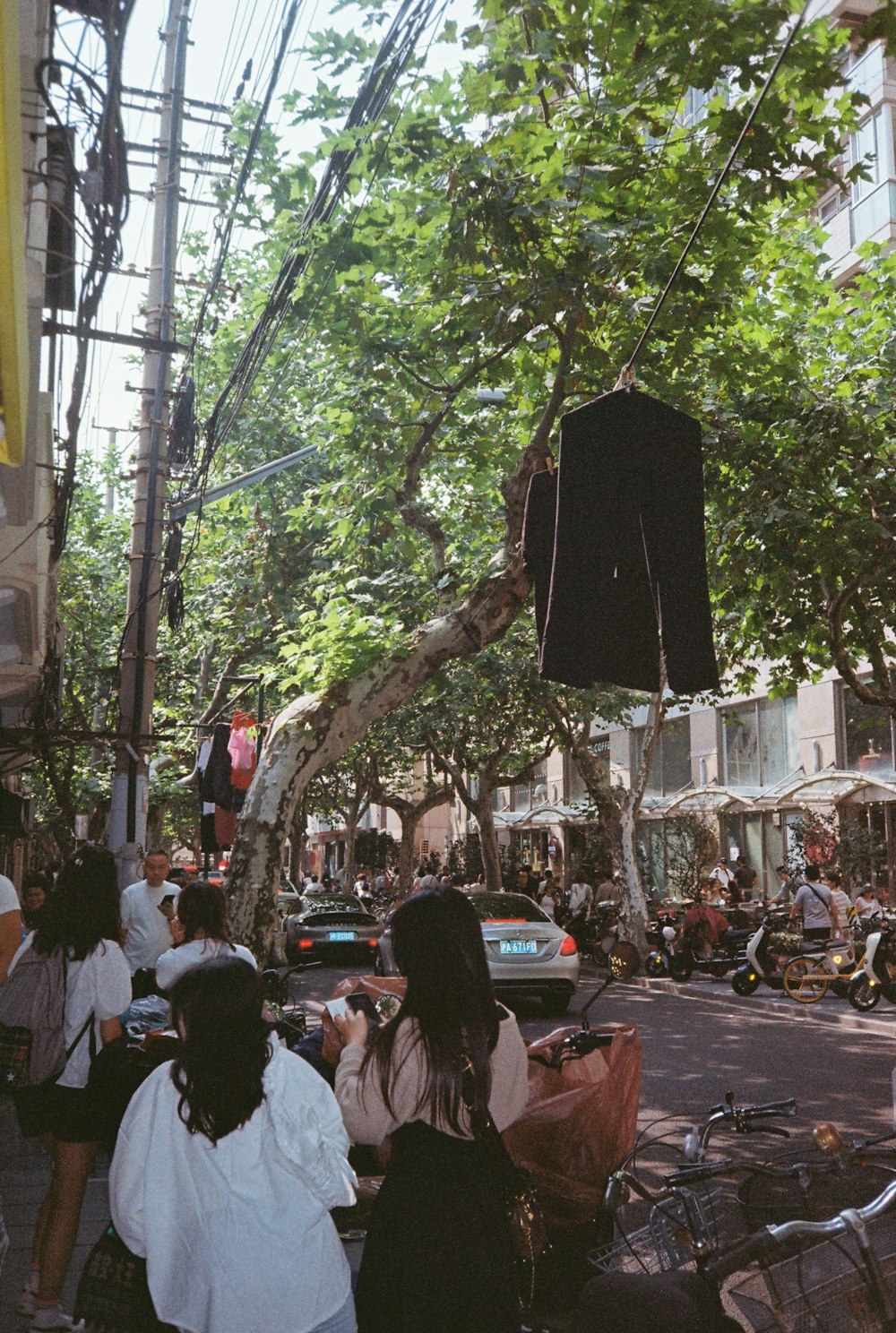 a group of people walking down a street