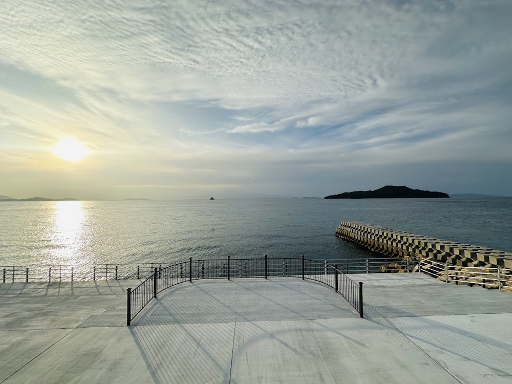 a large body of water sitting next to a pier