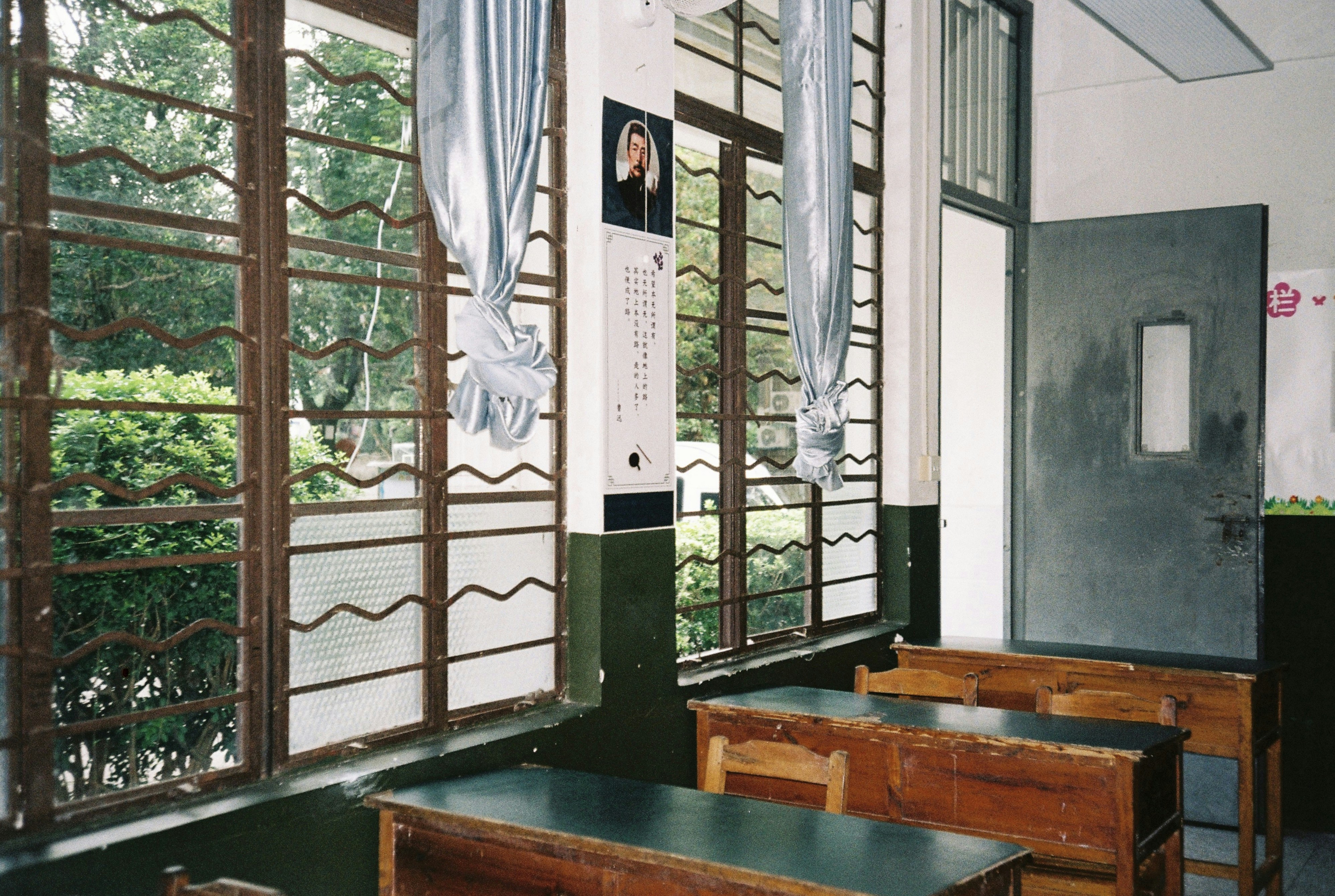 Classroom with wooden desks and windows