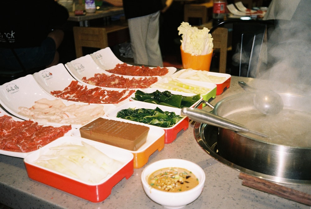 a buffet table filled with different types of food