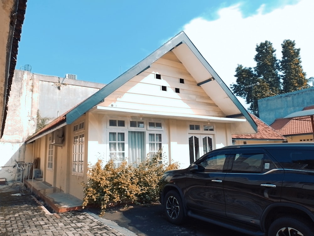 a car is parked in front of a house