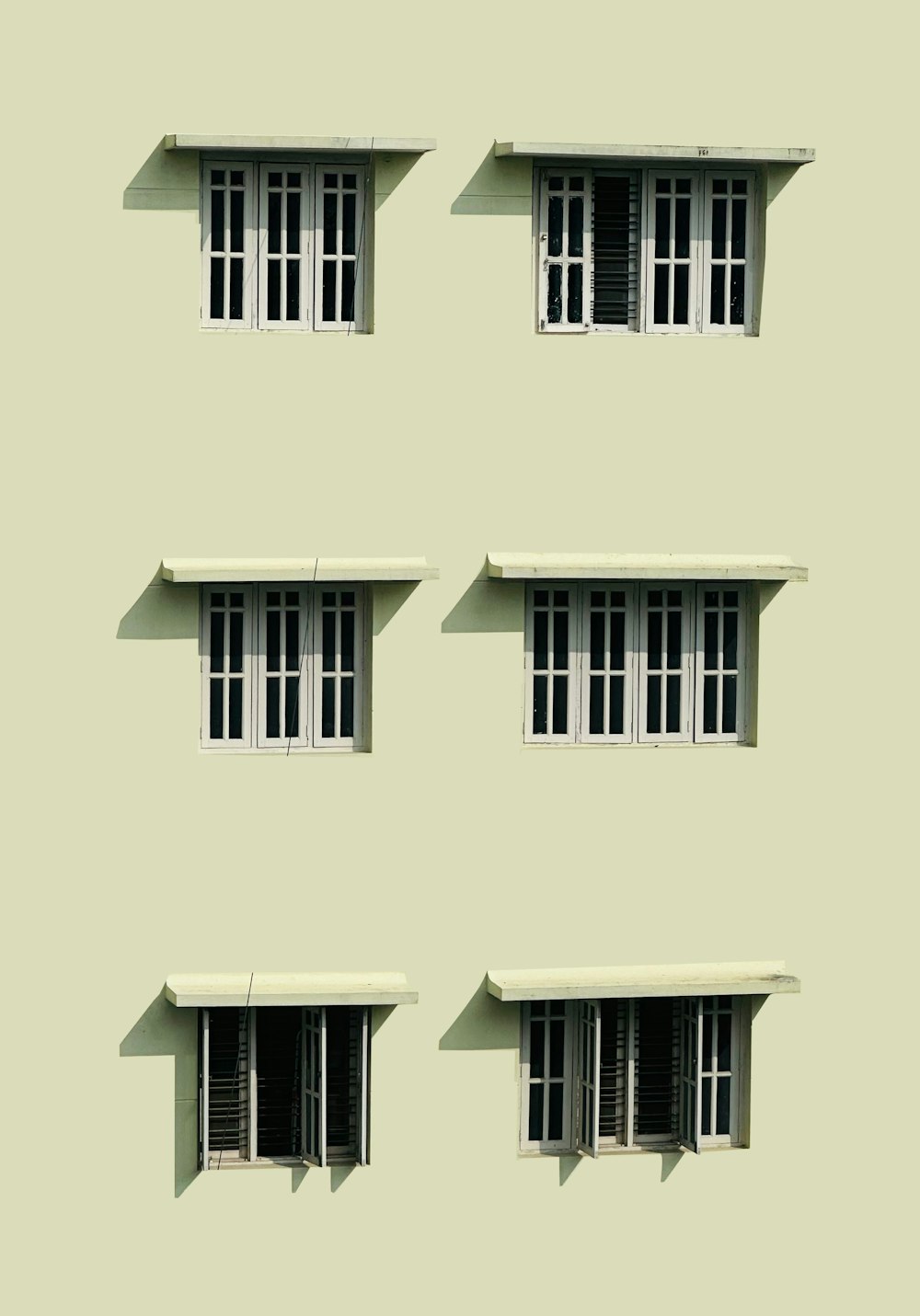 four windows with shutters on each of them