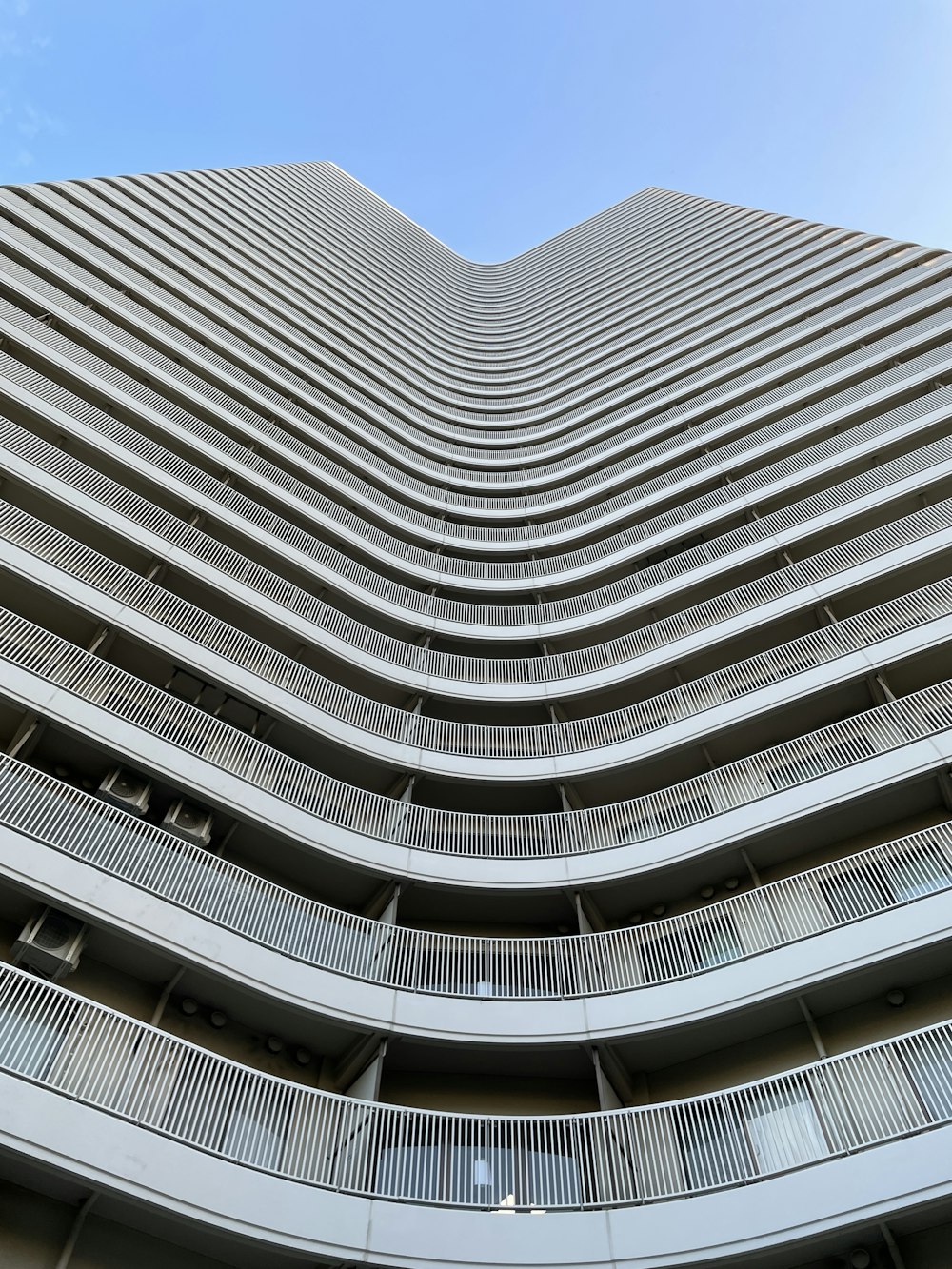 a tall building with balconies and balconies on the sides