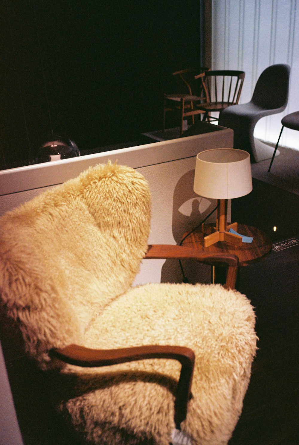 a chair and a lamp in a room