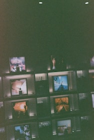 Artful arrangement of limited edition objects on a dark wood surface under soft, ambient lighting.